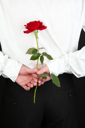 man holding rose close-up